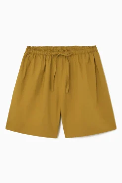 COS Shorts | Byxor*SHORTS MED RYNKNING OCH DRAGSKO