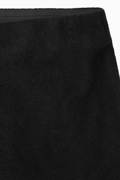 COS Kjolar | Stickat*UTSVÄNGD MIDIKJOL I MERINOULL